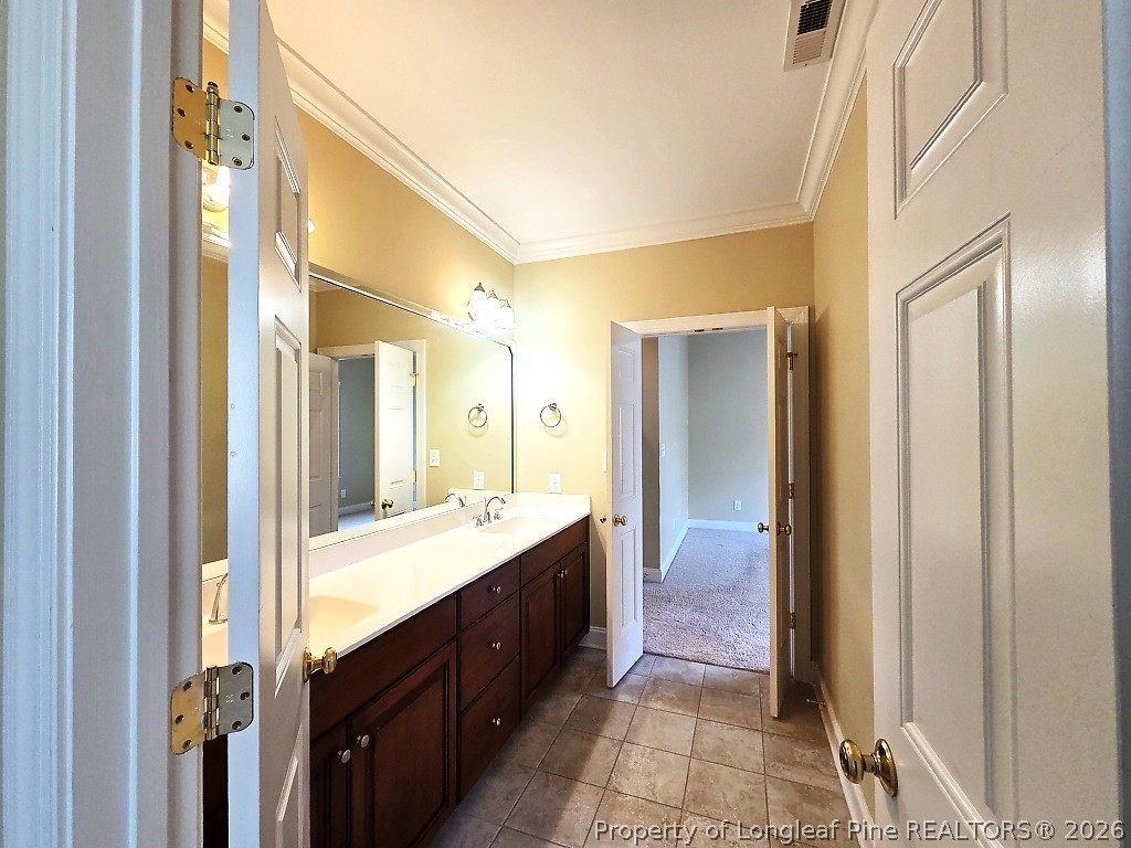 2671 Lockwood Road, Unit 202 Fayetteville, NC 28303 - Photo 22 of 32 a bathroom with a double vanity sink and mirror with shower
