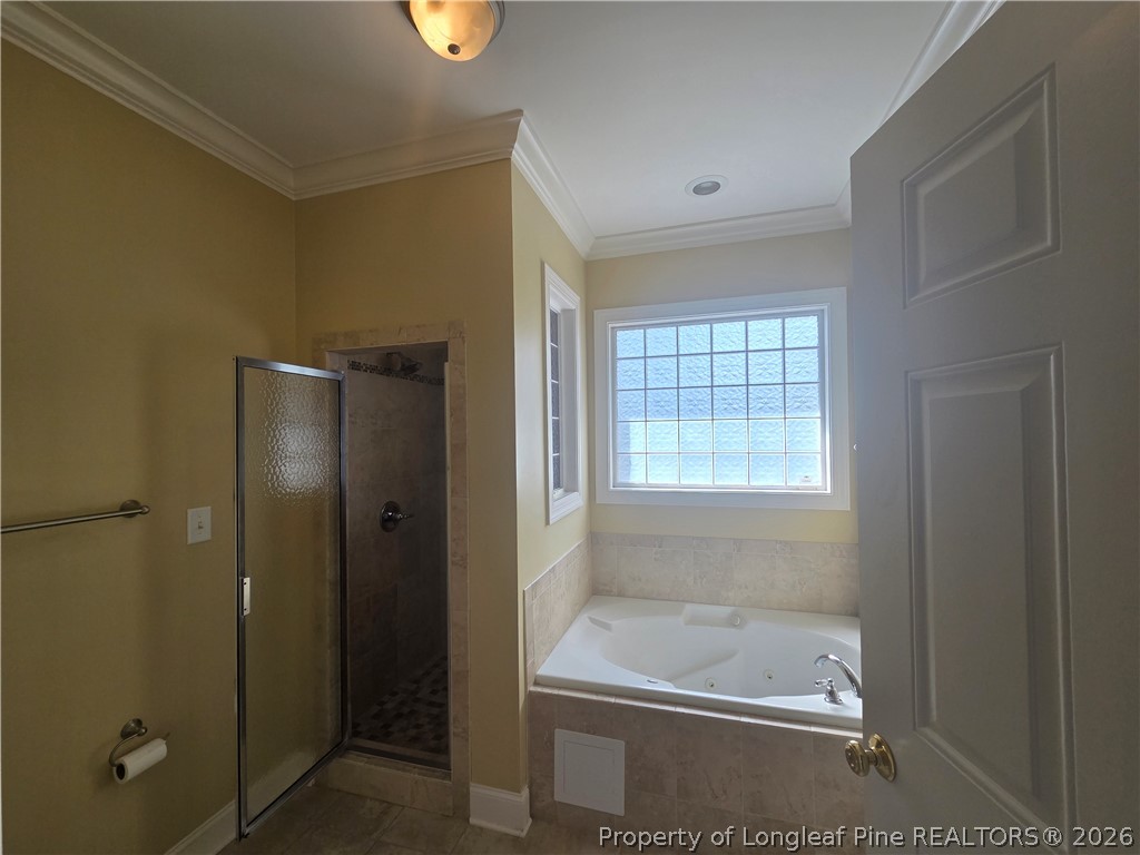 2671 Lockwood Road, Unit 202 Fayetteville, NC 28303 - Photo 23 of 32 a bathroom with a bathtub and a shower