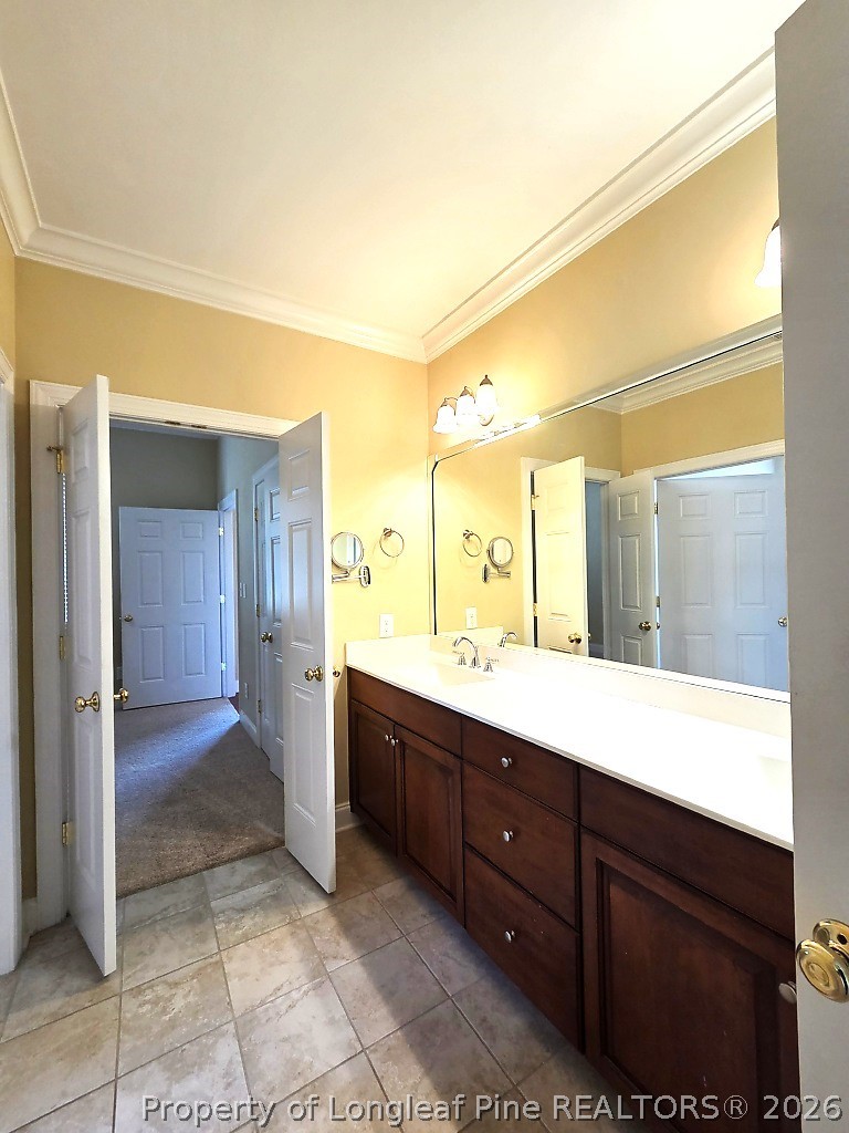 2671 Lockwood Road, Unit 202 Fayetteville, NC 28303 - Photo 24 of 32 a bathroom with a sink mirror and shower