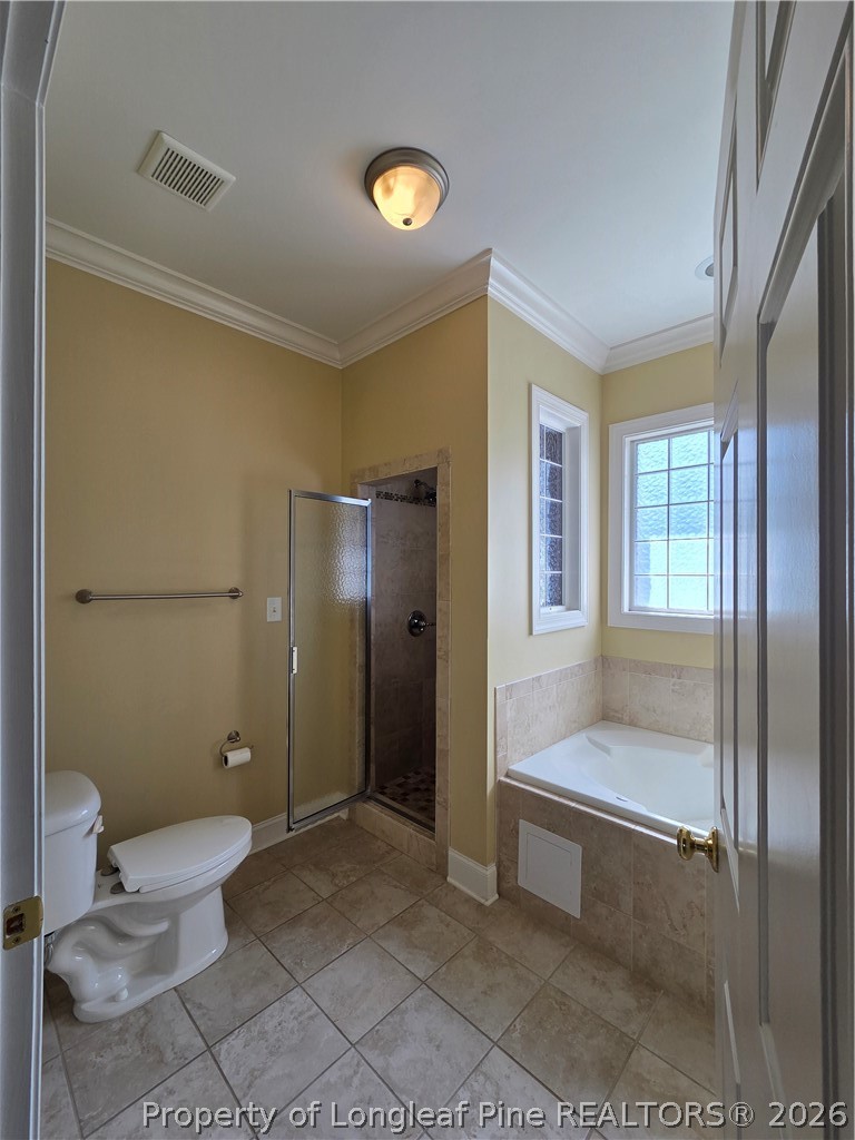 2671 Lockwood Road, Unit 202 Fayetteville, NC 28303 - Photo 26 of 32 a bathroom with a toilet and a shower