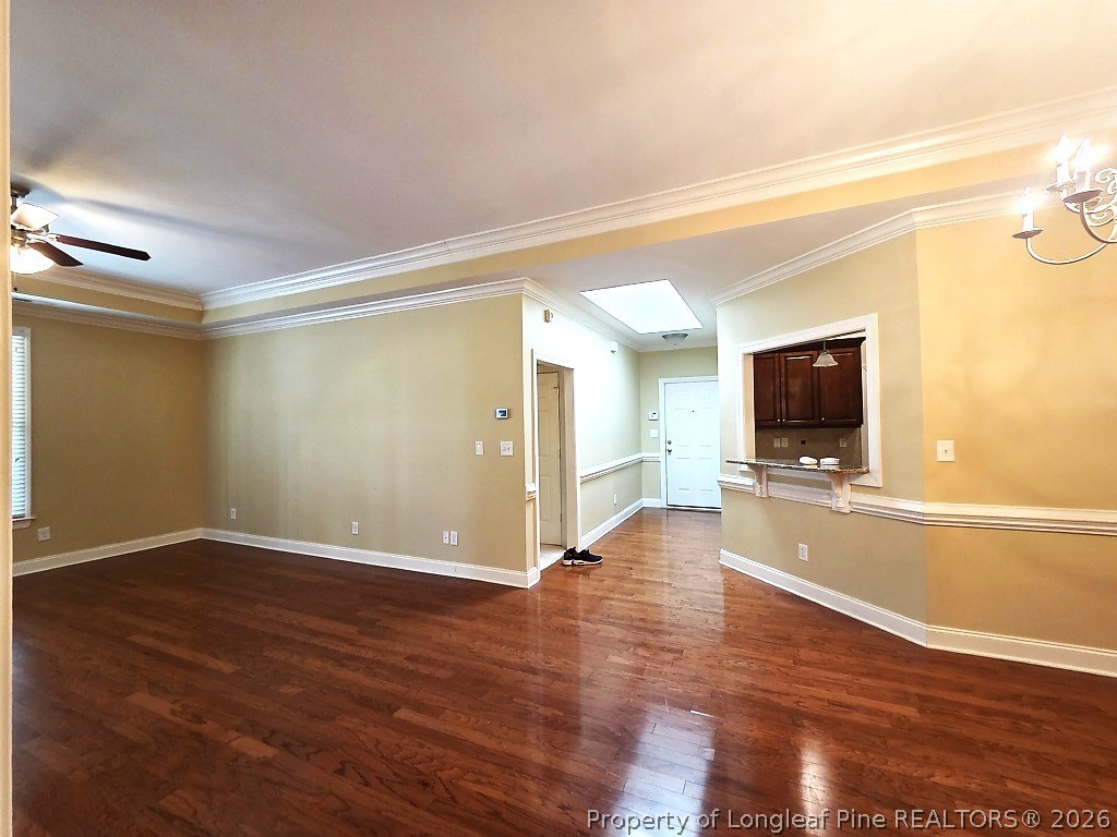 2671 Lockwood Road, Unit 202 Fayetteville, NC 28303 - Photo 4 of 32 a view of a livingroom with wooden floor and a flat screen tv
