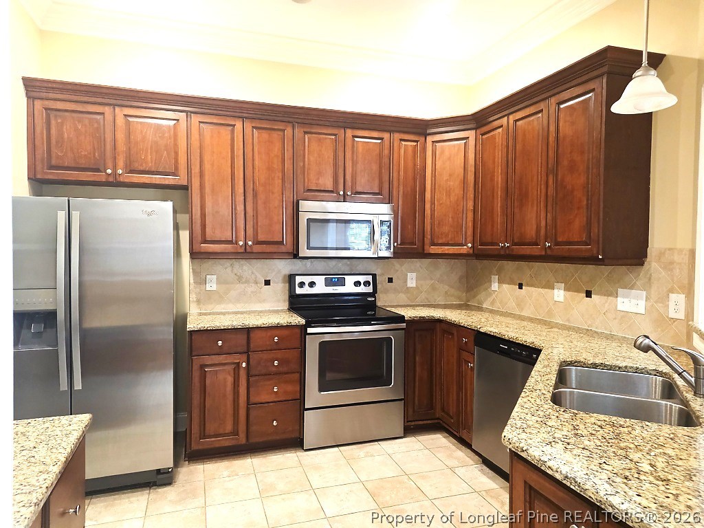 2671 Lockwood Road, Unit 202 Fayetteville, NC 28303 - Photo 5 of 32 a kitchen with a sink stove and refrigerator