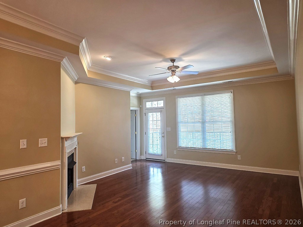 2671 Lockwood Road, Unit 202 Fayetteville, NC 28303 - Photo 10 of 32 a view of an empty room with wooden floor and fan