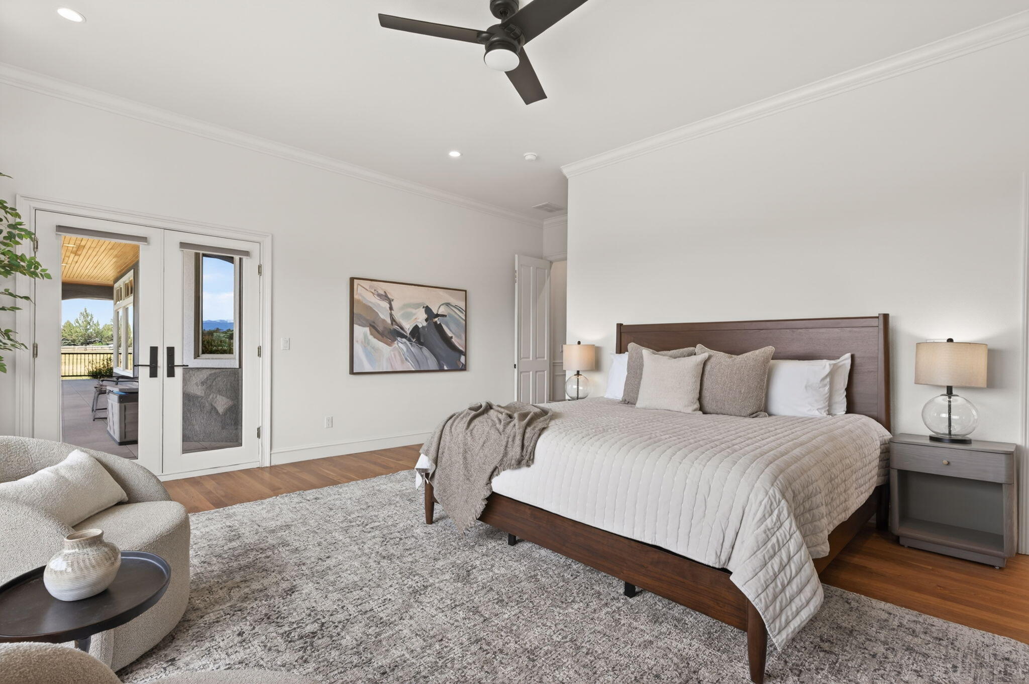 20180 Winston Loop Bend, OR 97703 - Photo 20 of 59 a bedroom with a bed and wooden floor