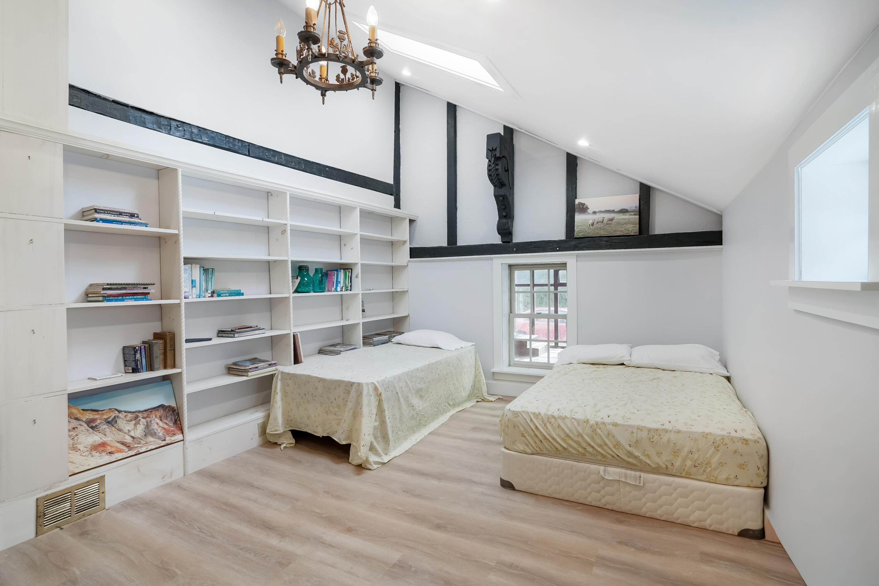 32 Norton Orchard Road Edgartown, MA 02539 - Photo 14 of 26 a bedroom with a bed a dresser and book shelf