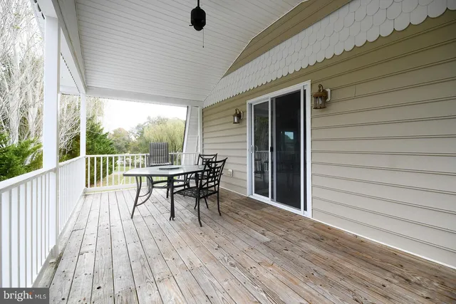 a kitchen with stainless steel appliances granite countertop a refrigerator a stove a sink and a microwave