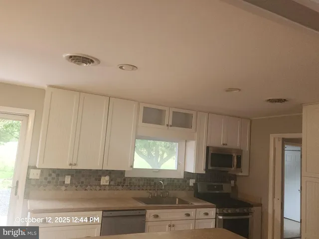 a view of an empty room with a window