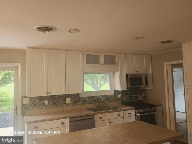 a bathroom with a shower and toilet