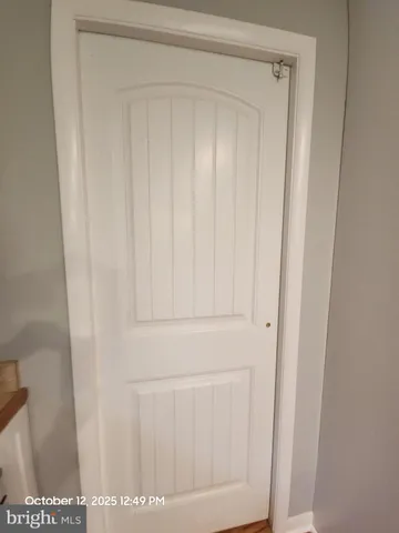 a view of a livingroom with furniture and a kitchen