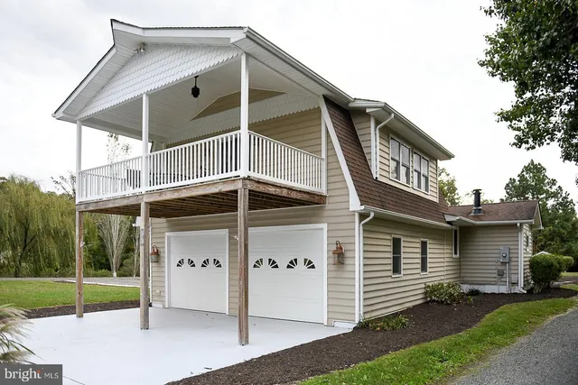 an aerial view of a house with yard