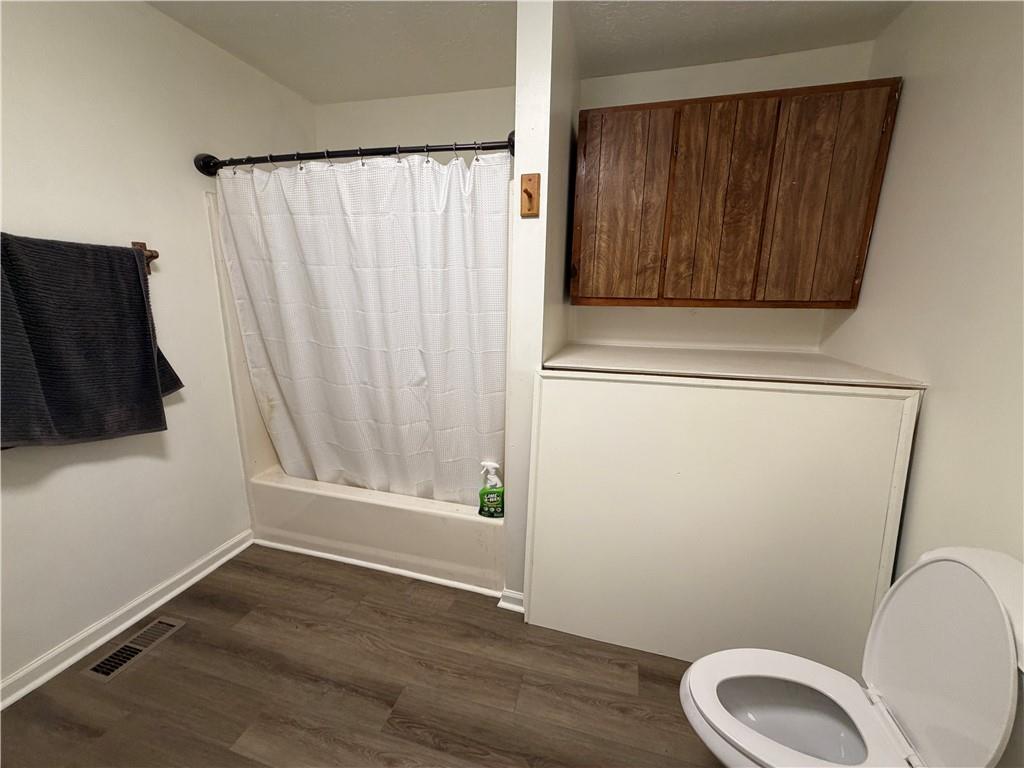 86 Robert Jones Road Dawsonville, GA 30534 - Photo 11 of 19 a bathroom with a toilet and a sink