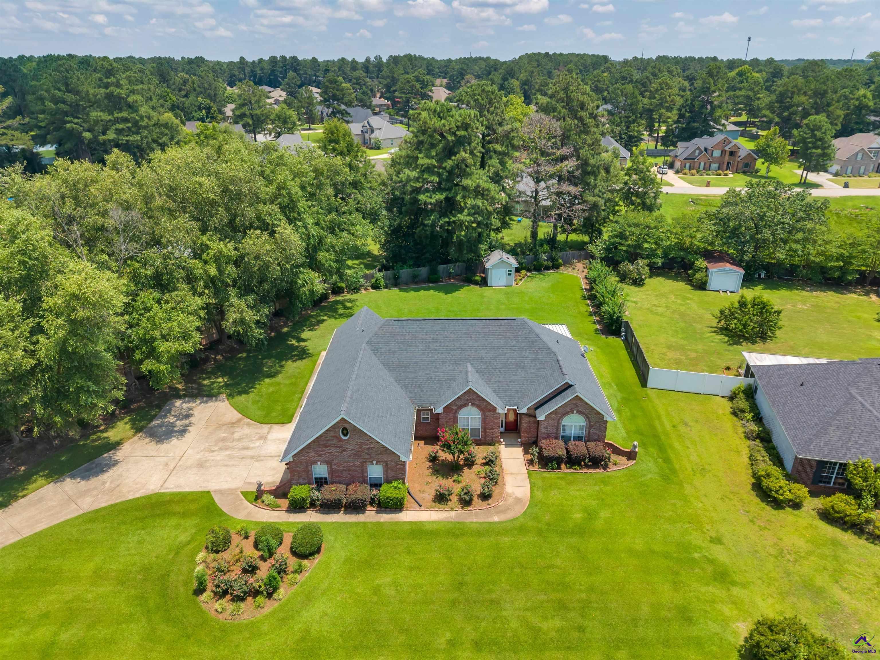 206 North Hampton Place Perry, GA 31069 - Photo 18 of 20 an aerial view of a house with swimming pool big yard and mountain view in back