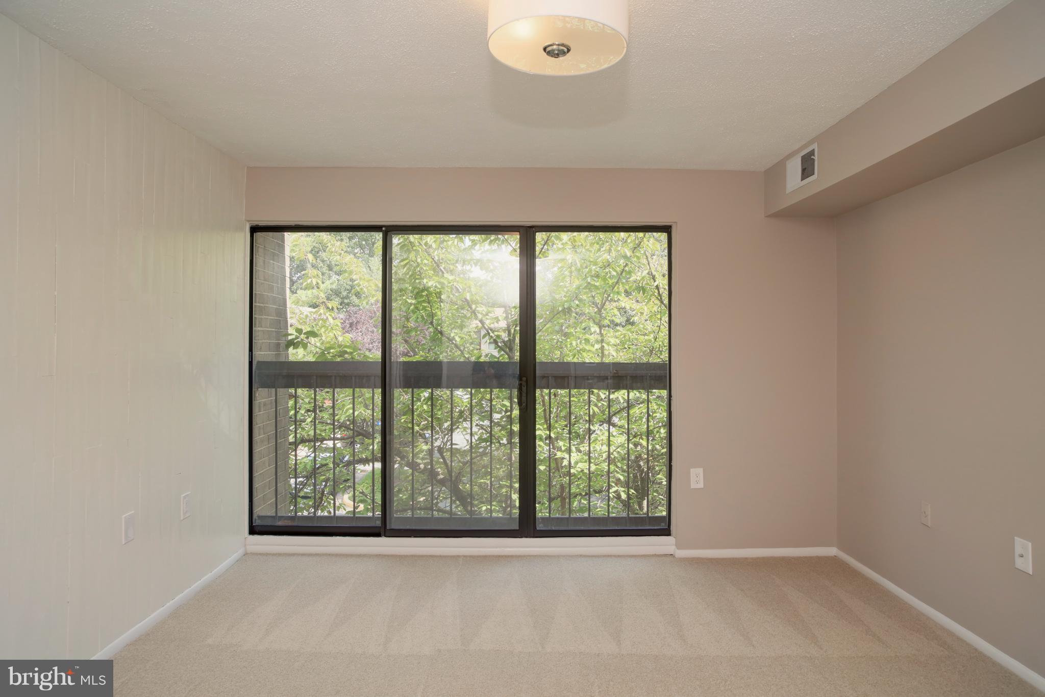 11616 Ivystone Court, Unit 301 Reston, VA 20191 - Photo 17 of 29 a view of an empty room with a window