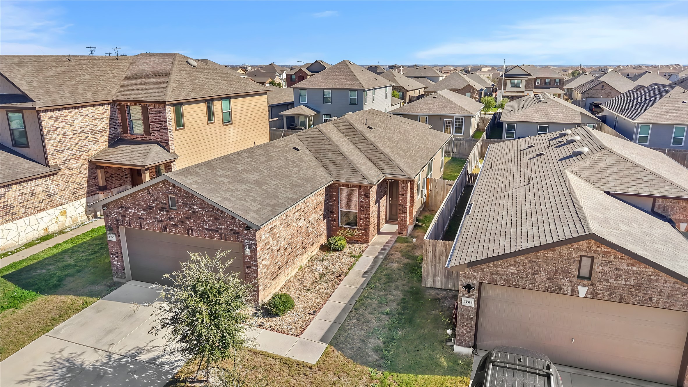 13917 Inaugural Street Manor, TX 78653 - Photo 2 of 39 Aerial perspective of suburban area