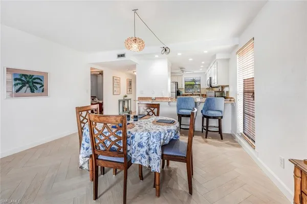a view of a dining room with furniture