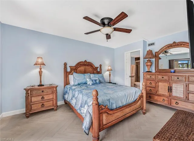 a bedroom with bed and window