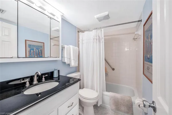 a bedroom with two beds and a window