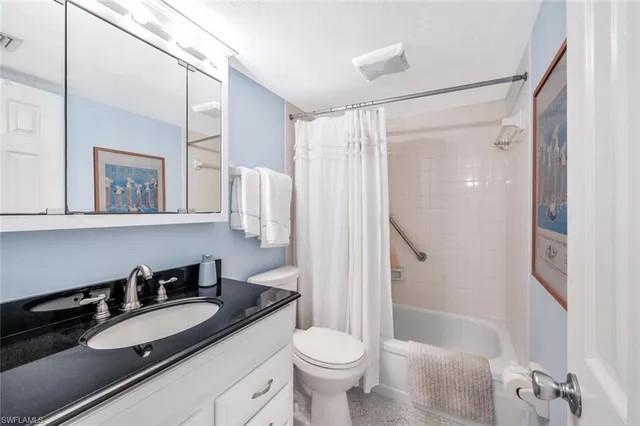 a bedroom with two beds and a window