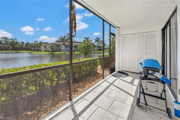 a view of swimming pool with outdoor seating