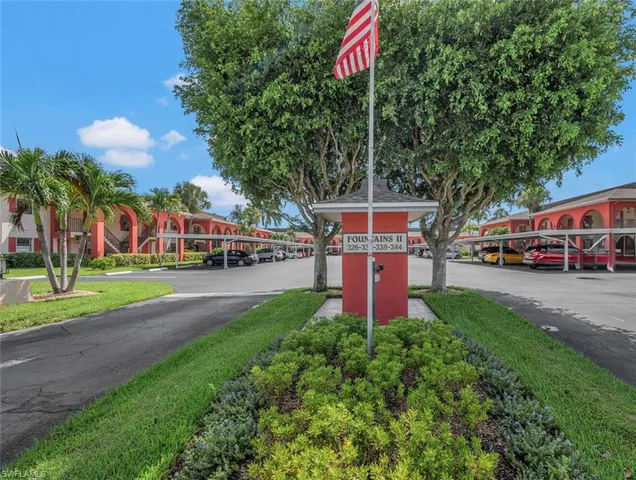 a front view of a building with garden