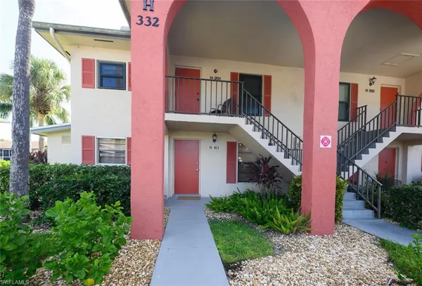 a view of a house with a street