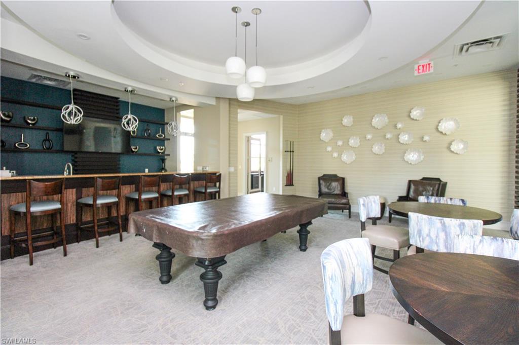 9123 Strada Place, Unit 7410 Naples, FL 34108 - Photo 18 of 50 Rec room featuring carpet flooring, bar area, billiards, and a raised ceiling