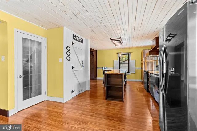a view of an entryway with wooden floor