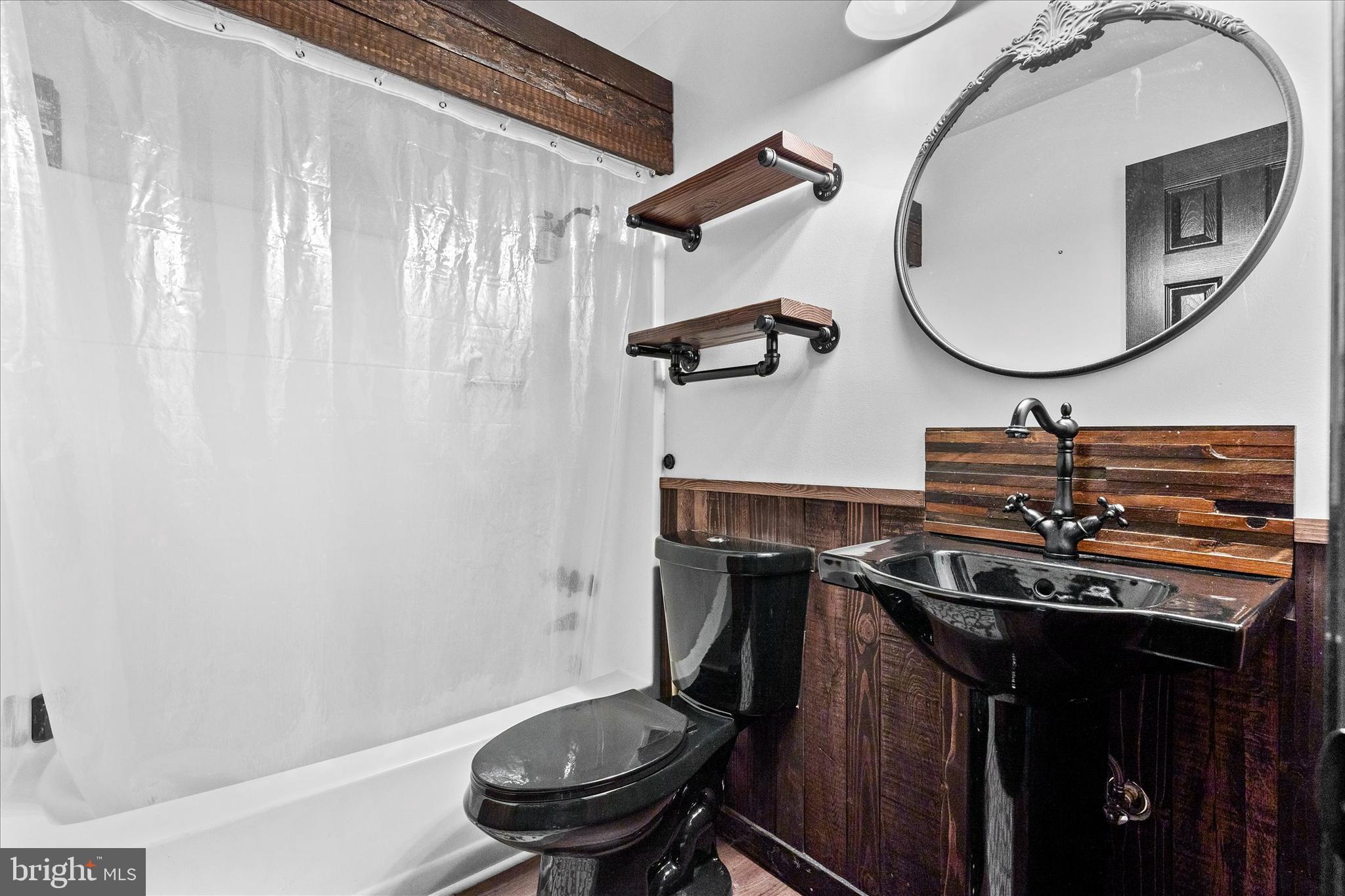 1769 Rainbow Circle York, PA 17408 - Photo 15 of 38 a bathroom with a sink a toilet and a mirror