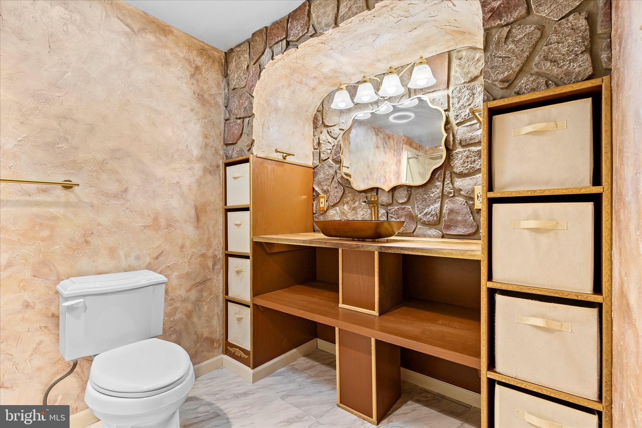 1769 Rainbow Circle York, PA 17408 - Photo 21 of 38 a bathroom with a toilet and a mirror