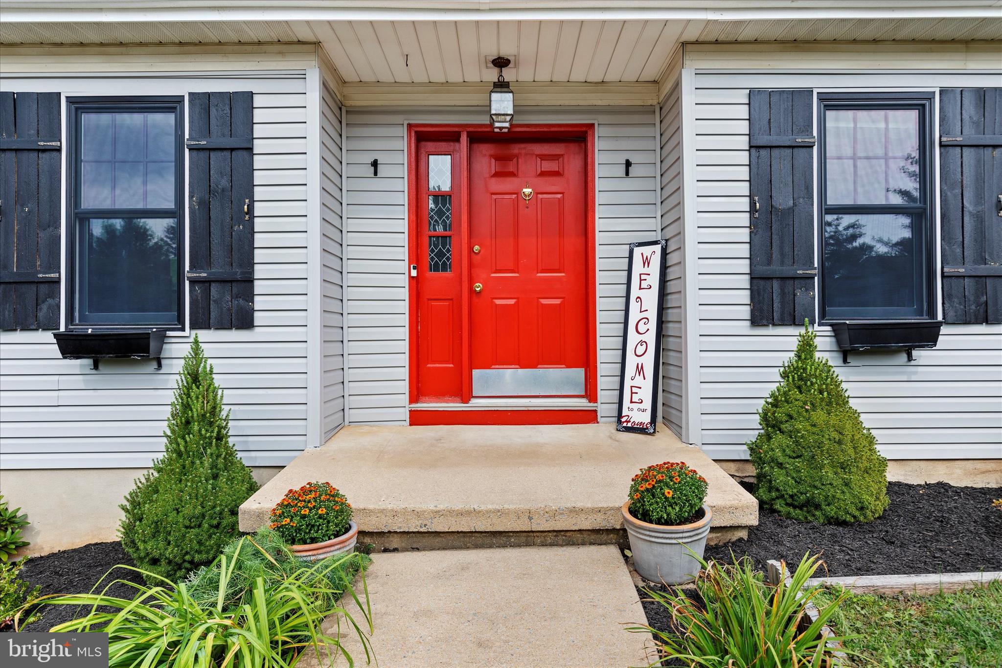 1769 Rainbow Circle York, PA 17408 - Photo 5 of 38 a front view of a house with a potted plant