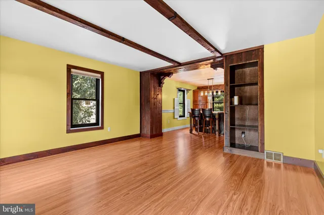 a view of an entryway with wooden floor