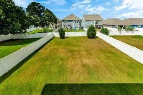a view of swimming pool is middle in the garden