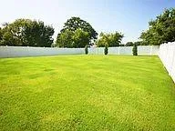 a view of outdoor space with deck and yard