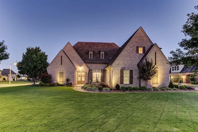 a front view of house with garden