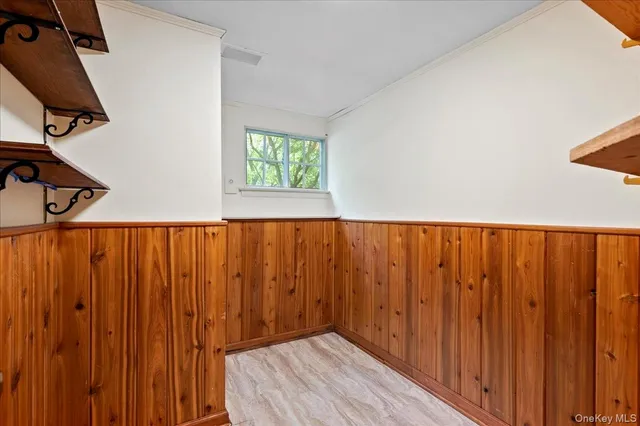 a bathroom with a granite countertop sink and a bathtub