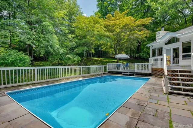 a view of house with a roof deck