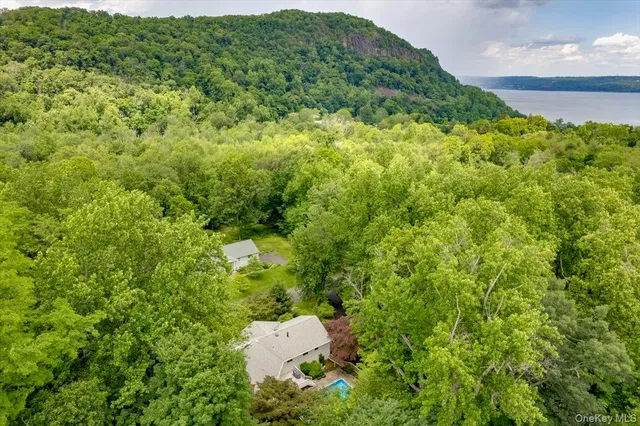 aerial view of a house with swimming pool and sitting area