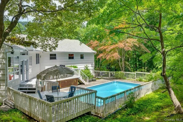 a living room with furniture fireplace and flat screen tv
