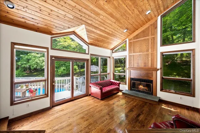 a living room with furniture and large windows