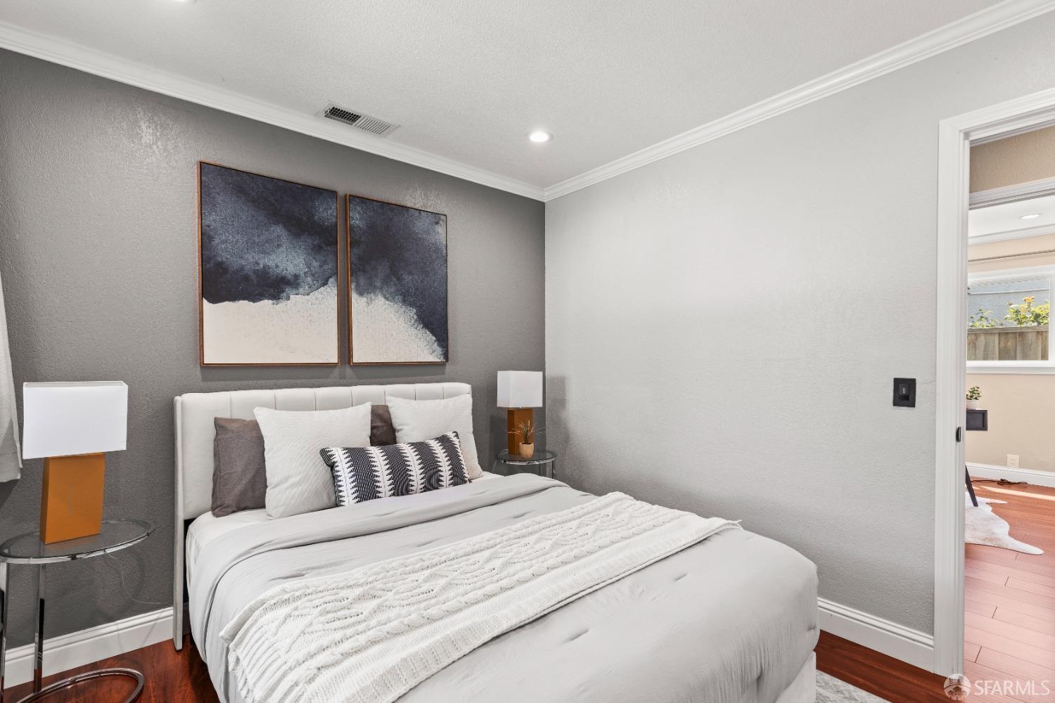 2445 Cabrillo Drive Hayward, CA 94545 - Photo 26 of 49 a bedroom with a bed and a painting on the wall