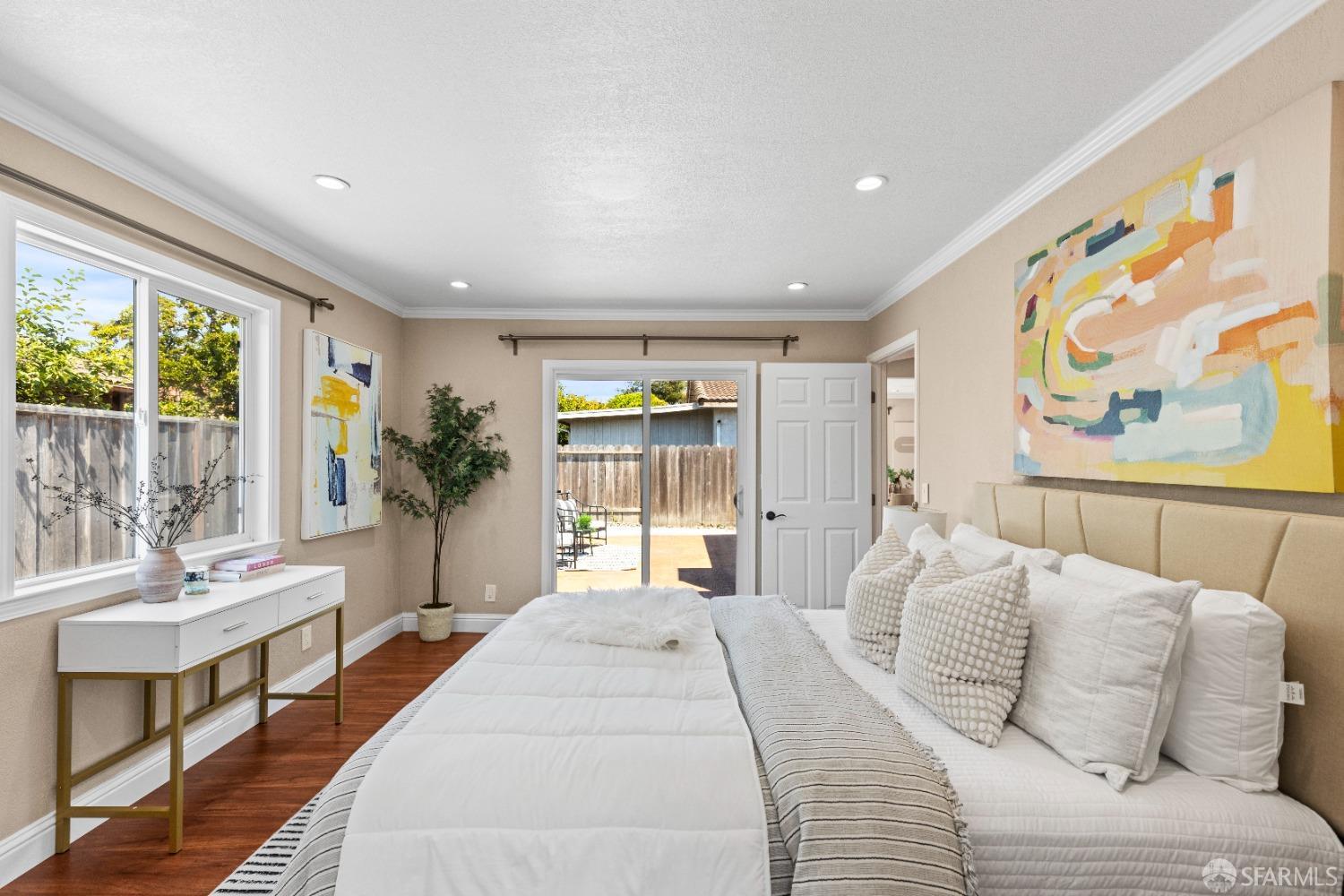 2445 Cabrillo Drive Hayward, CA 94545 - Photo 31 of 49 a bedroom with a large bed and a potted plant