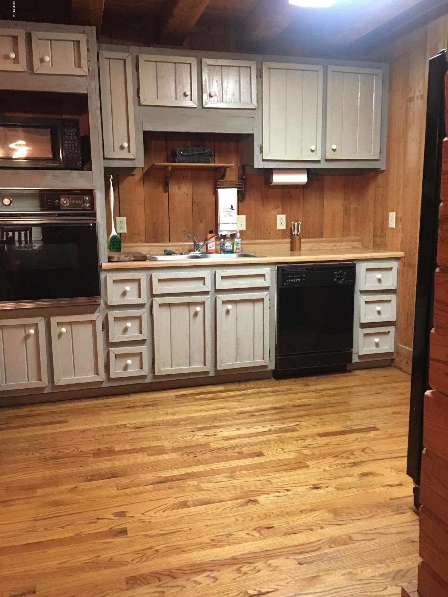 4155 Fulton Mill Road Macon, GA 31216 - Photo 3 of 20 a kitchen with stainless steel appliances granite countertop a stove a sink and a microwave
