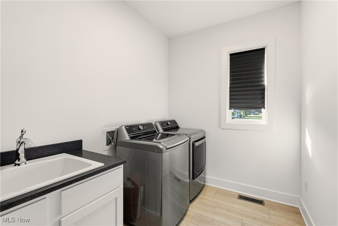 5906 Russia Road Amherst, OH 44001 - Photo 27 of 50 1st floor laundry with washer & dryer