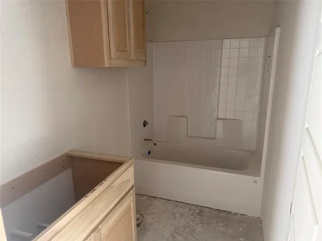 a bathroom with a bathtub