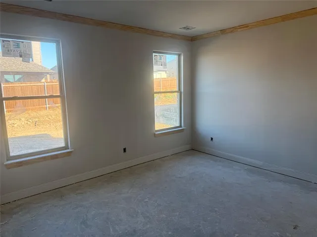 an empty room with windows