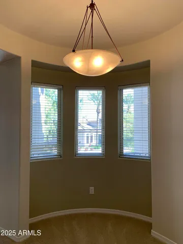 a kitchen with stainless steel appliances granite countertop wooden cabinets a stove and a sink