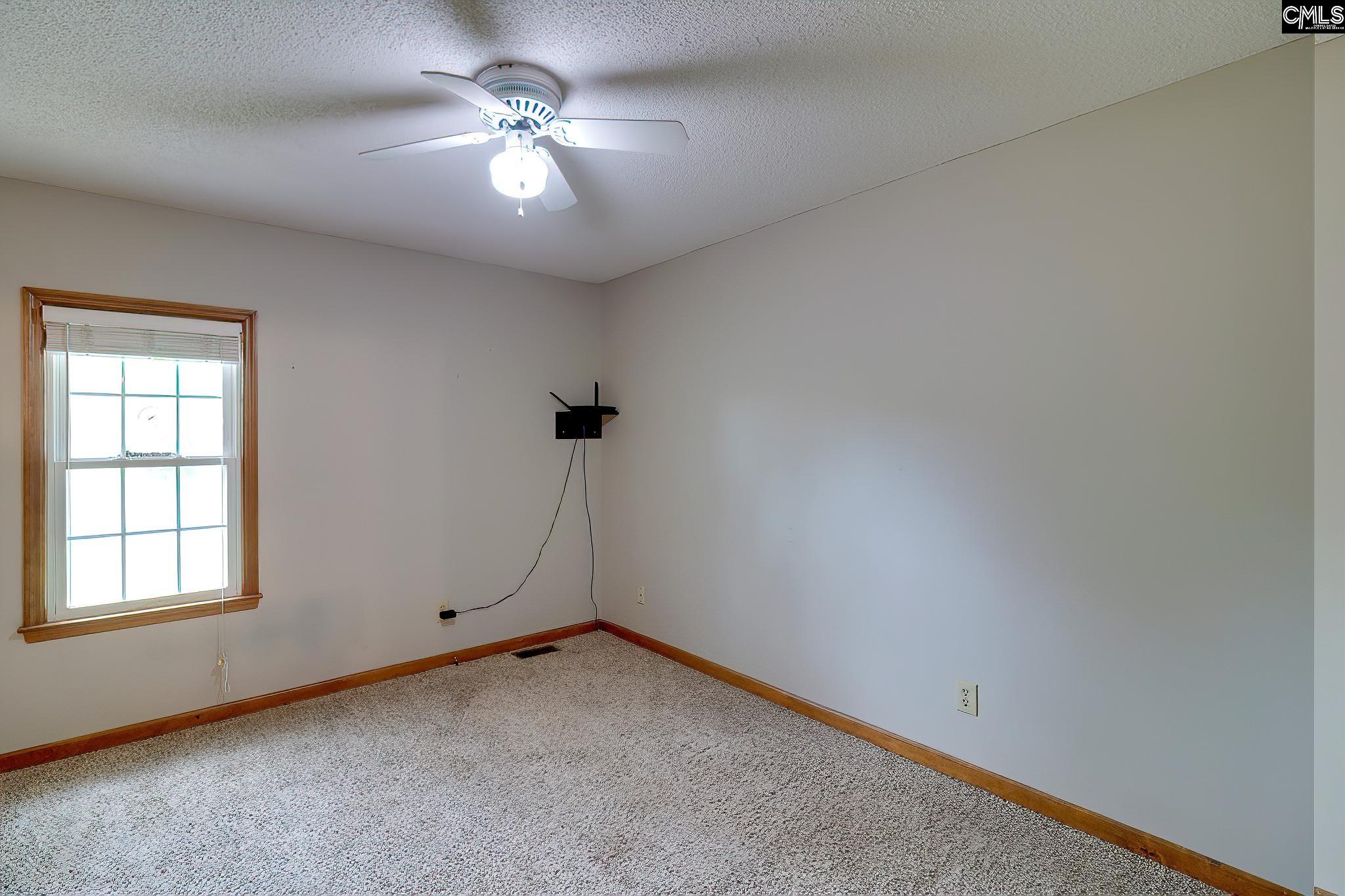 1415 State Rd S-28-55 Lugoff, SC 29078 - Photo 27 of 39 wooden floor in an empty room with a window