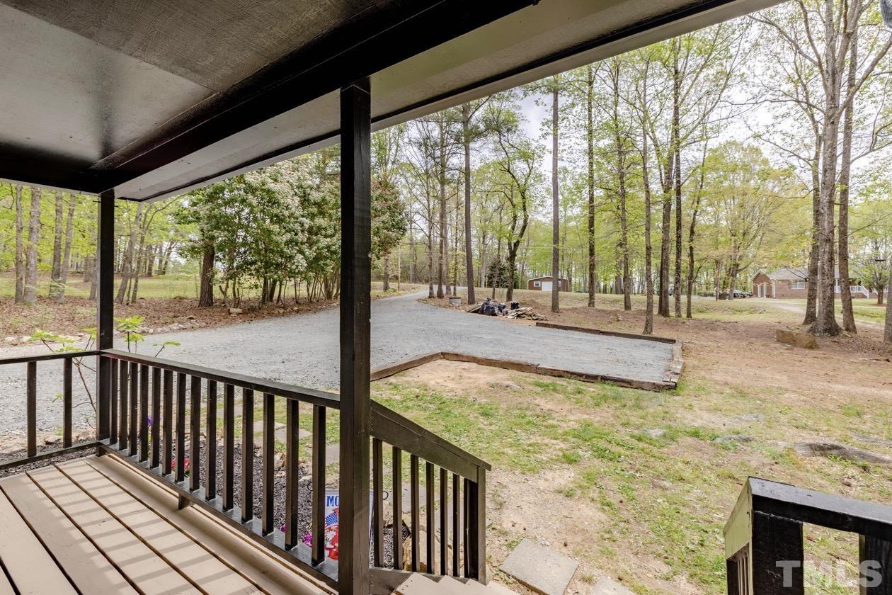 6803 Russell Road Durham, NC 27712 - Photo 27 of 27 a view of a room with wooden floor and outdoor space