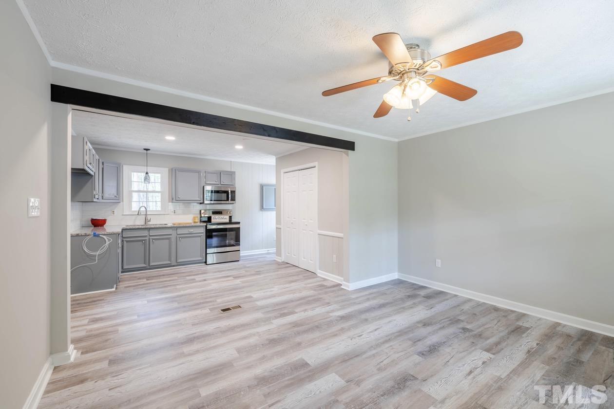 6803 Russell Road Durham, NC 27712 - Photo 4 of 27 a view of kitchen with wooden floor