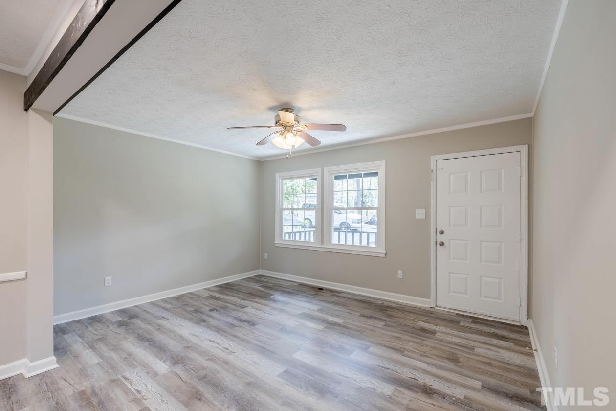 6803 Russell Road Durham, NC 27712 - Photo 5 of 27 a view of an empty room with a window